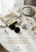 Here are a few product title options:

1. **Aurélia Seed Bead Button Studs**
2. **Woven Pearl Seed Earrings – Black & Ivory**
3. **Aurélia Signature Seed Studs**
4. **Handwoven Button Earrings – Duo Set**

Which style do you like best, ya koi aur directio